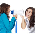 knitter making herself understood with a megaphone to a fellow knitter